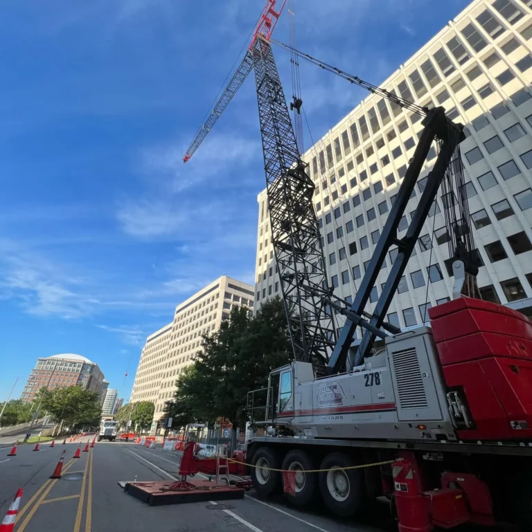 A truck mounted crane in action.